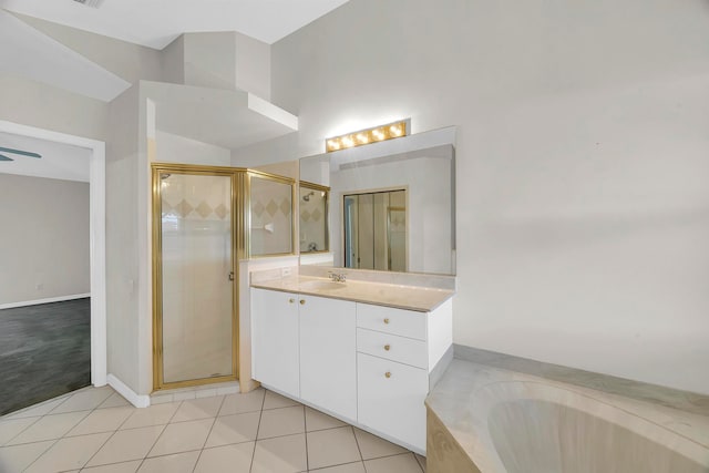 bathroom with vanity, plus walk in shower, and tile patterned floors