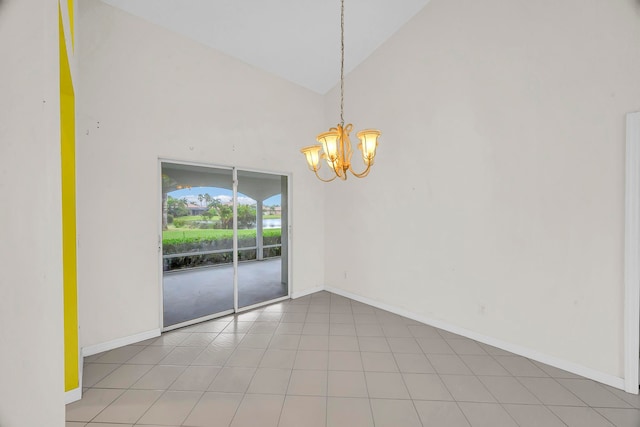 unfurnished dining area featuring a chandelier, high vaulted ceiling, and light tile patterned floors