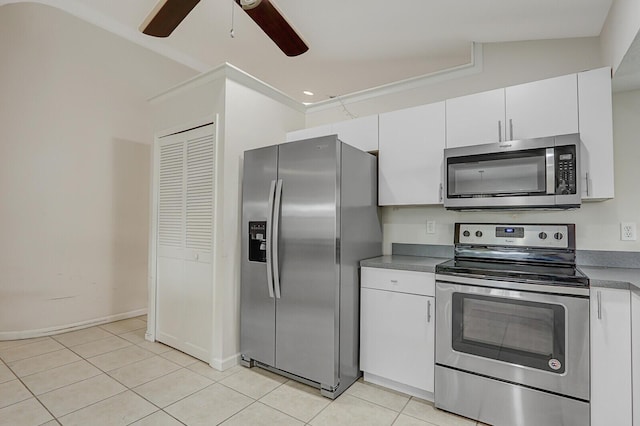 kitchen featuring light tile patterned floors, white cabinets, a ceiling fan, and stainless steel appliances