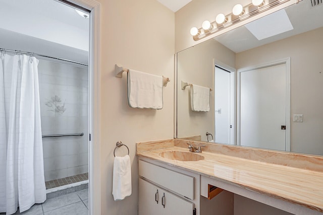 bathroom featuring vanity, a shower with curtain, and tile patterned flooring