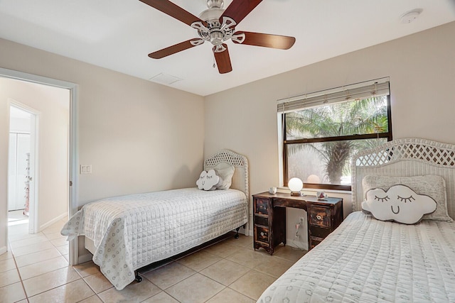 bedroom featuring light tile patterned floors, baseboards, a ceiling fan, and visible vents