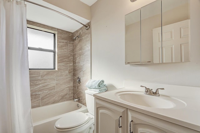 bathroom featuring vanity, shower / bath combo, and toilet
