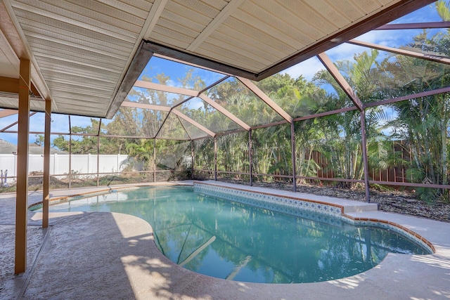 view of swimming pool featuring a fenced in pool, a lanai, a fenced backyard, and a patio area