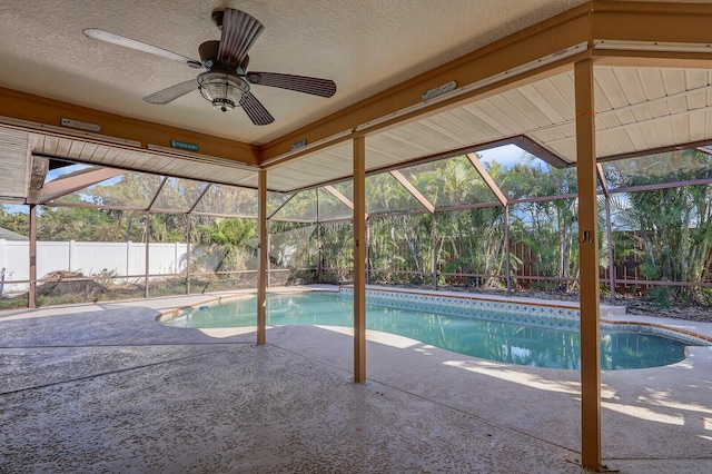 pool featuring a fenced backyard, ceiling fan, a patio area, and a lanai