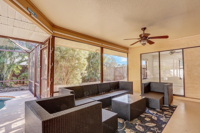 sunroom / solarium with ceiling fan