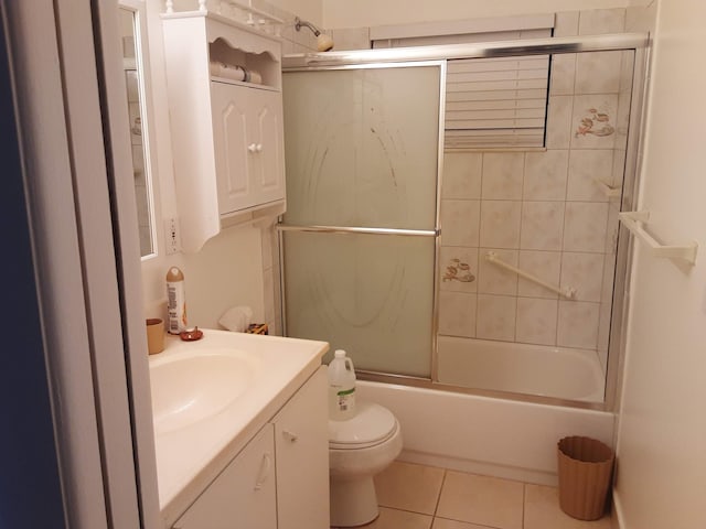 full bathroom featuring enclosed tub / shower combo, tile patterned flooring, vanity, and toilet