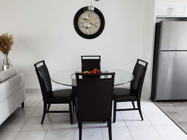 dining area featuring light tile patterned flooring