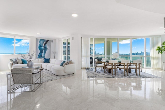 living room with plenty of natural light and floor to ceiling windows