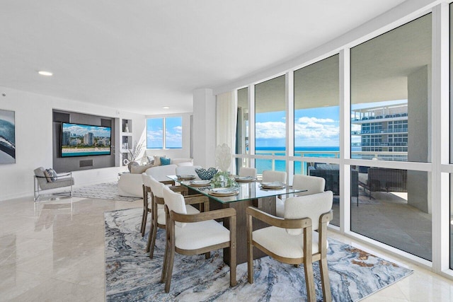 dining area with a wall of windows