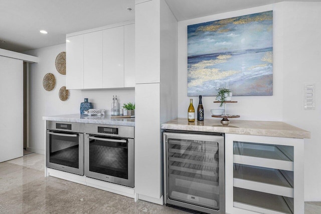 bar featuring white cabinetry and wine cooler