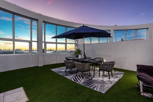 view of patio terrace at dusk