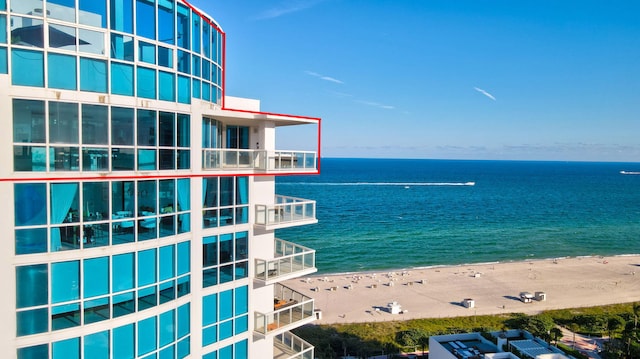 property view of water featuring a beach view