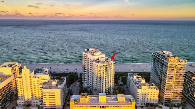 aerial view at dusk with a water view