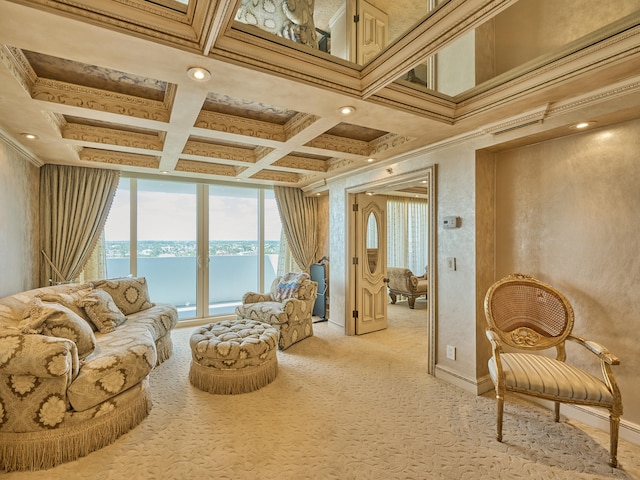 sitting room with light colored carpet, a water view, coffered ceiling, ornamental molding, and beam ceiling