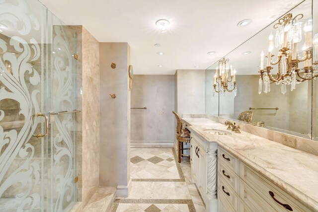 bathroom with a chandelier, vanity, and toilet