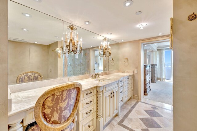 bathroom with vanity, toilet, and tiled shower