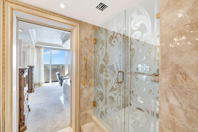 full bath featuring recessed lighting, a marble finish shower, visible vents, and ornamental molding