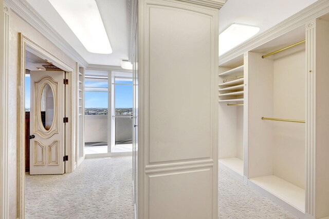 bathroom featuring a tub to relax in, vanity, toilet, and ornamental molding