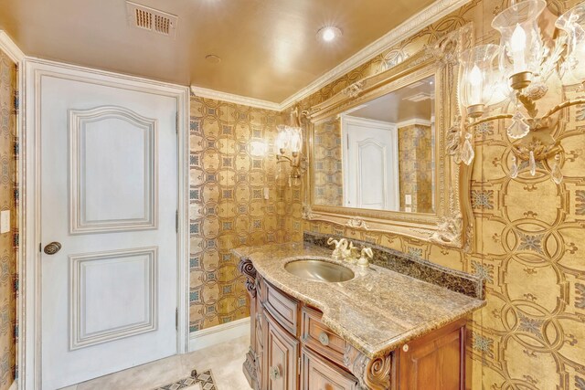 carpeted bedroom with ornamental molding, ornate columns, beamed ceiling, and coffered ceiling