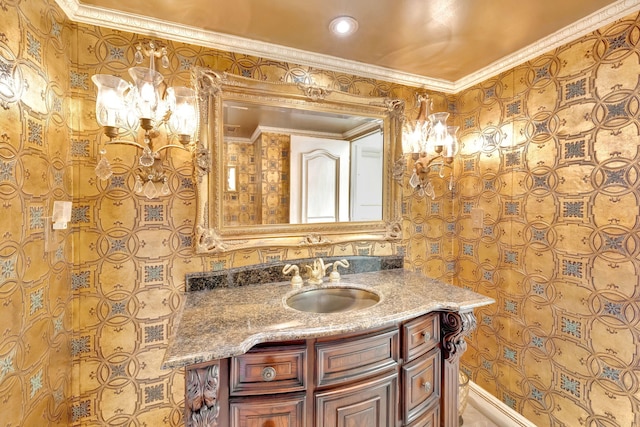 bathroom featuring ornamental molding and vanity