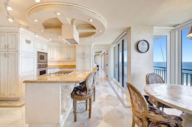 kitchen featuring stone counters, sink, backsplash, and dishwasher