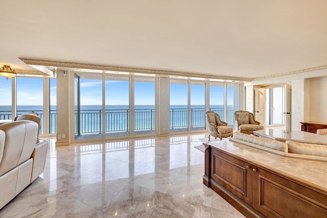 living room with marble finish floor, a wall of windows, and a water view