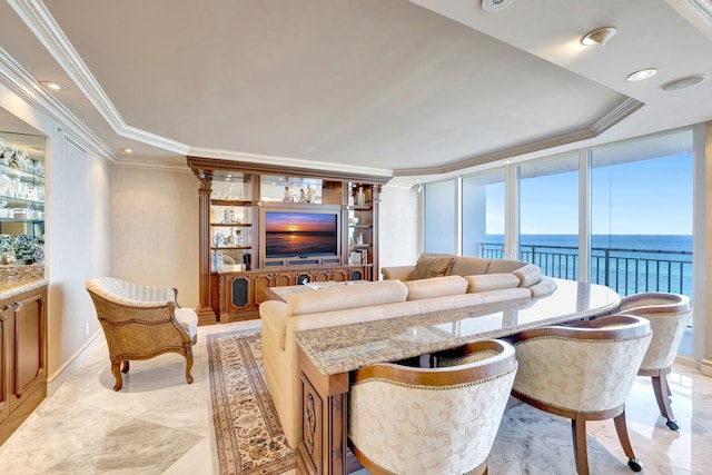 living area featuring floor to ceiling windows, a tray ceiling, recessed lighting, and crown molding