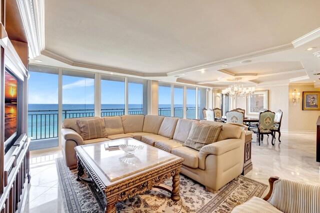 kitchen with stainless steel appliances, a water view, cream cabinets, backsplash, and pendant lighting