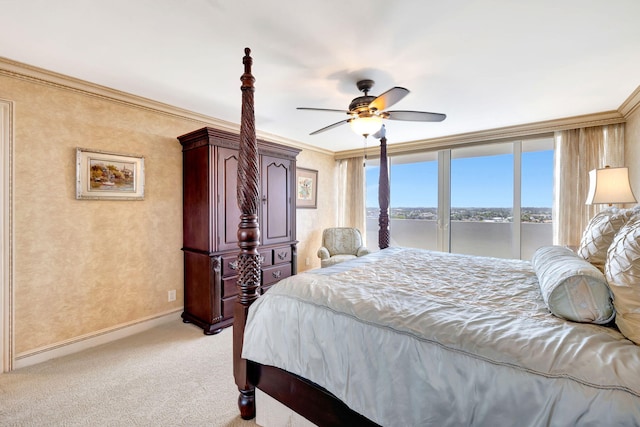 bedroom with light carpet, ceiling fan, baseboards, and crown molding