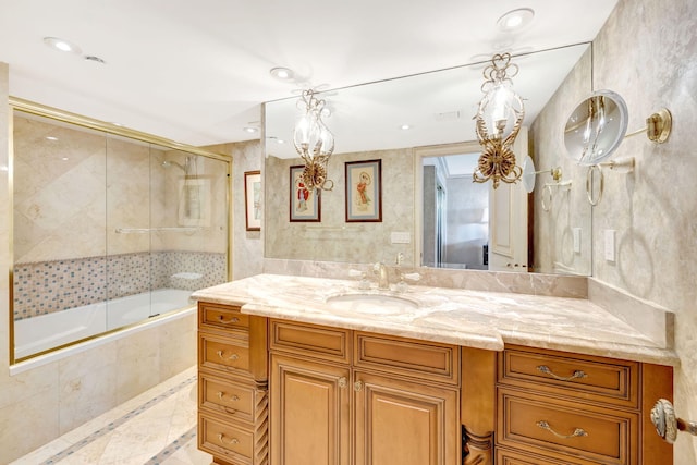 full bathroom with tiled shower / bath combo, vanity, and recessed lighting