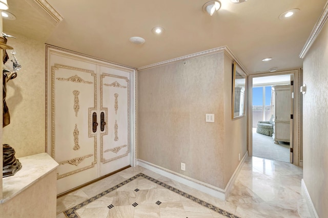 bathroom featuring marble finish floor, baseboards, crown molding, and recessed lighting