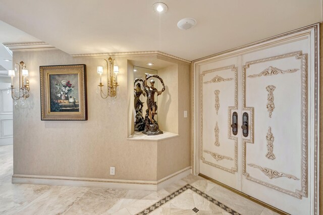 living room with an inviting chandelier, a water view, and crown molding