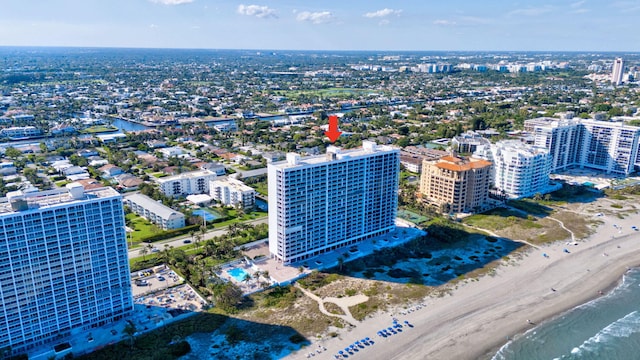 aerial view featuring a water view, a view of the beach, and a city view