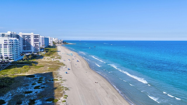 aerial view with a water view and a view of the beach