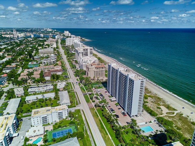 aerial view with a water view and a view of the beach