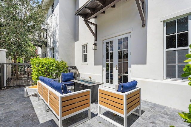 view of patio featuring french doors, grilling area, and outdoor lounge area