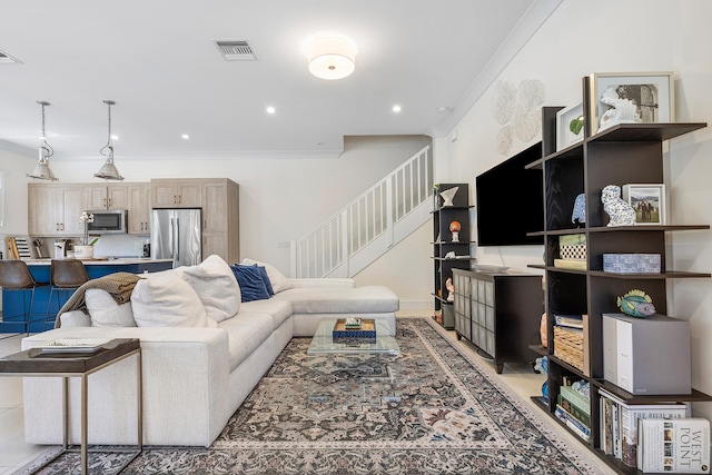 living room featuring crown molding