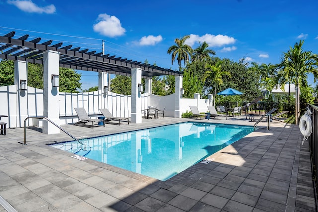 view of pool with a patio and a pergola