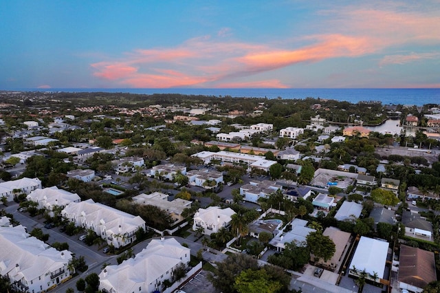 aerial view at dusk with a water view