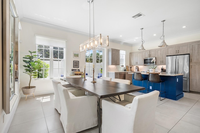 tiled dining area with crown molding