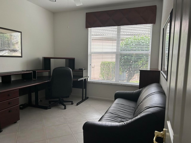 tiled office with a healthy amount of sunlight and ceiling fan