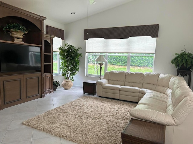 living room featuring light tile patterned floors and vaulted ceiling