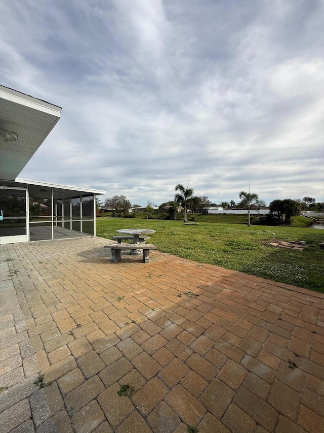 view of patio / terrace with a sunroom