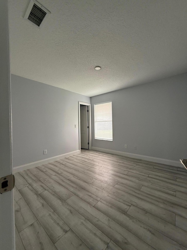 empty room with light wood-type flooring