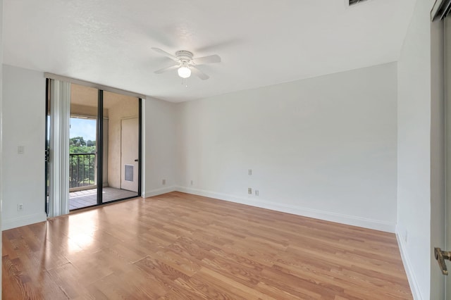 unfurnished room featuring light hardwood / wood-style floors and ceiling fan