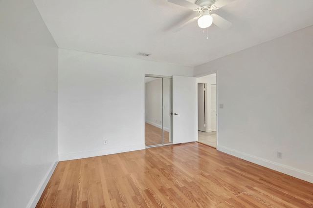 unfurnished room featuring light hardwood / wood-style flooring and ceiling fan