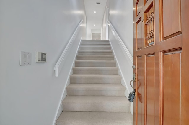 stairway with carpet flooring