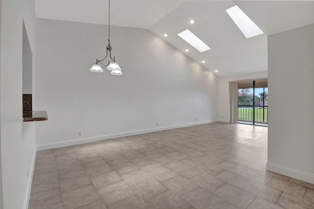 unfurnished living room with high vaulted ceiling and a chandelier