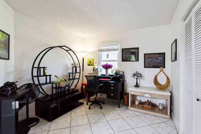 office area with a textured ceiling