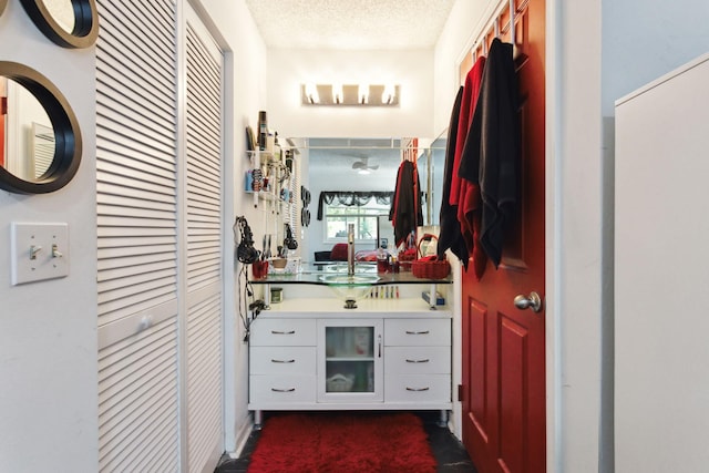 bathroom featuring vanity and a textured ceiling